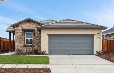 Exterior view of a house showing a front-facing garage door