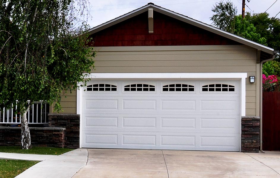 Front view of a suburban home with garage door