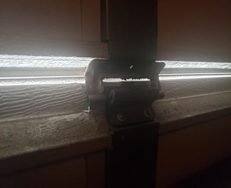 A clearly visible gap letting in light and air into the garage door,